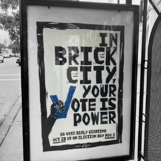 Bus shelter poster in Newark reading In Brick City, your vote is power