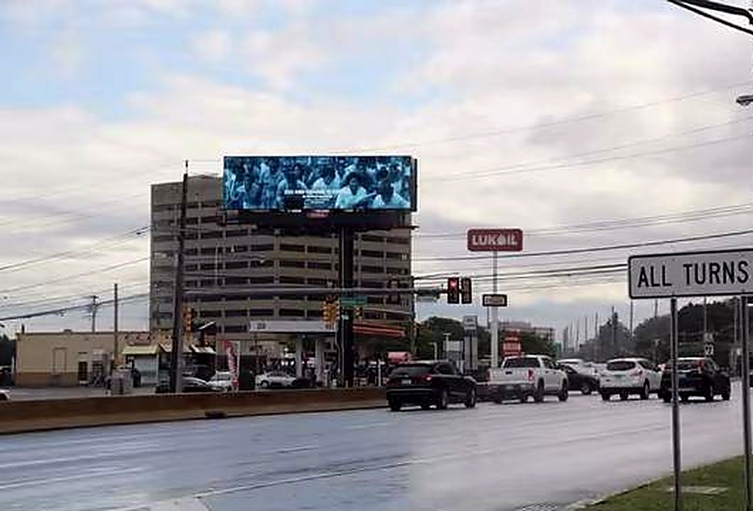 Drivers on Route 17 approaching the Carrie Mae Weems digital bulletin in Rutherford, New Jersey