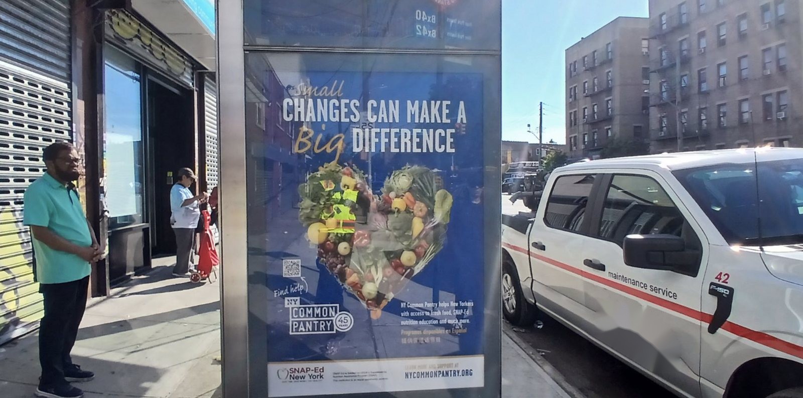 NY Common Pantry bus shelter ad reading Small Changes Can Make a Big Difference with riders waiting