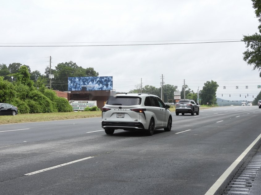 Drivers approaching the Carrie Mae Weems bulletin on South Marietta Parkway