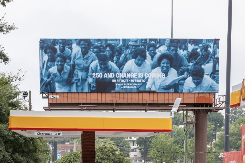 Carrie Mae Weems 250 and Change Is Coming bulletin above a gas station on 14th Street, Atlanta