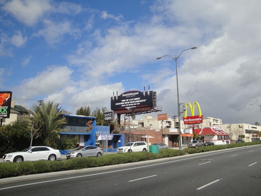 Street view of the SmithHouse bulletin with tap extensions above Santa Monica Boulevard traffic