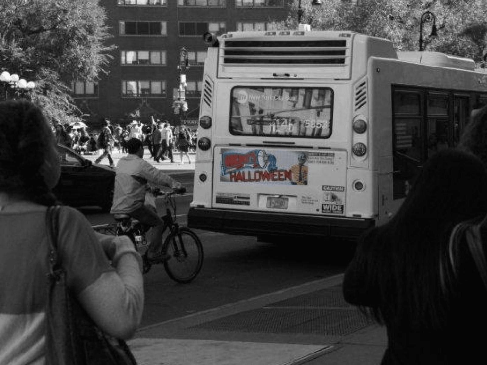 Ricky’s Halloween bus tail on a city bus pulling away in Manhattan